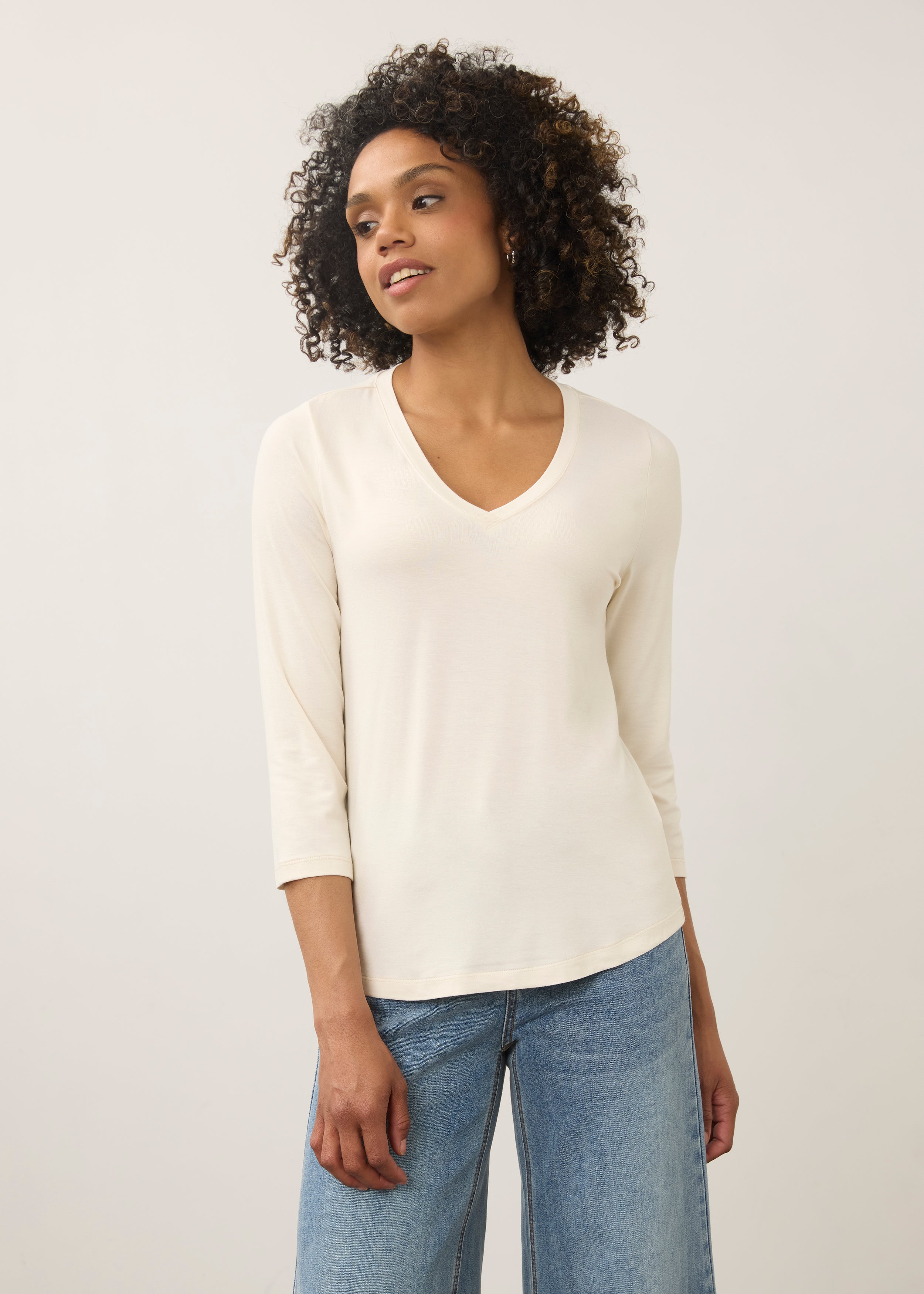 Front view of cream 3/4 sleeve V-neck top showcasing soft fabric and classic fit by French Dressing Jeans (FDJ)