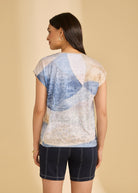 Back view of abstract blue and beige top with navy shorts highlighting casual summer look by French Dressing Jeans (FDJ)