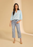 Model in embroidered ocean denim jeans with relaxed fit by French Dressing Jeans (FDJ)