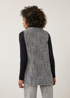 Back view of black and white textured vest featuring a longline silhouette by French Dressing Jeans (FDJ)