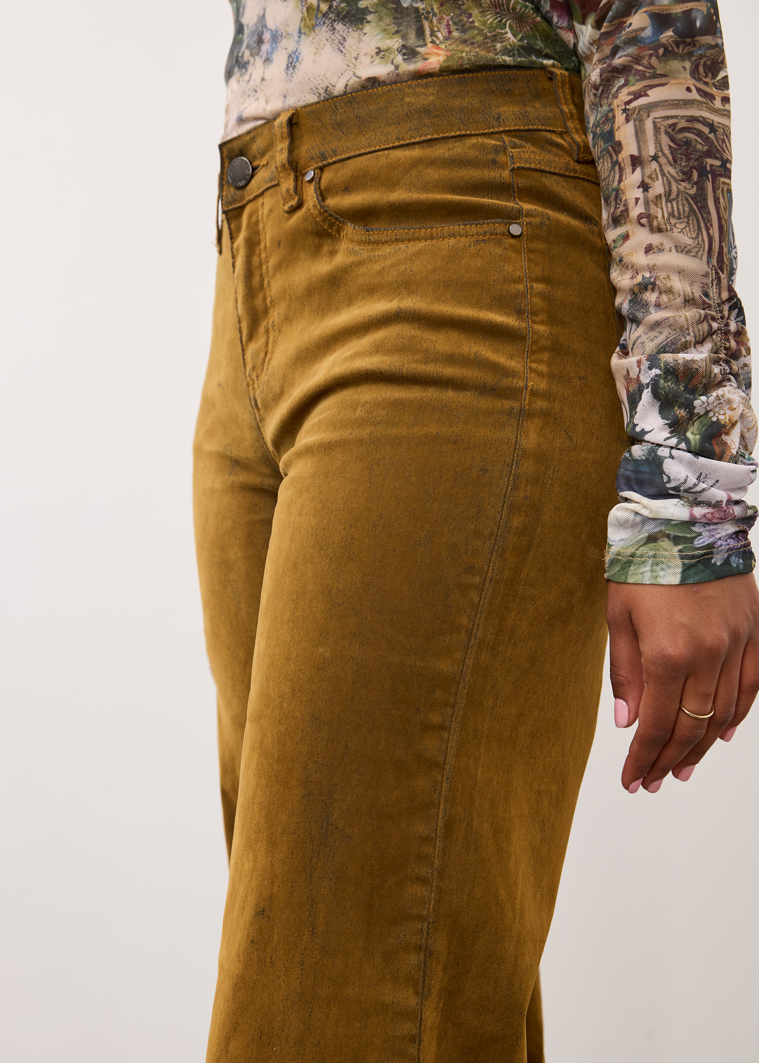 Side detail of brass Olivia denim showing mid-rise waist and slash pockets by French Dressing Jeans (FDJ)