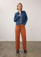 Full view of denim jacket paired with orange pants, showing casual style by French Dressing Jeans (FDJ)