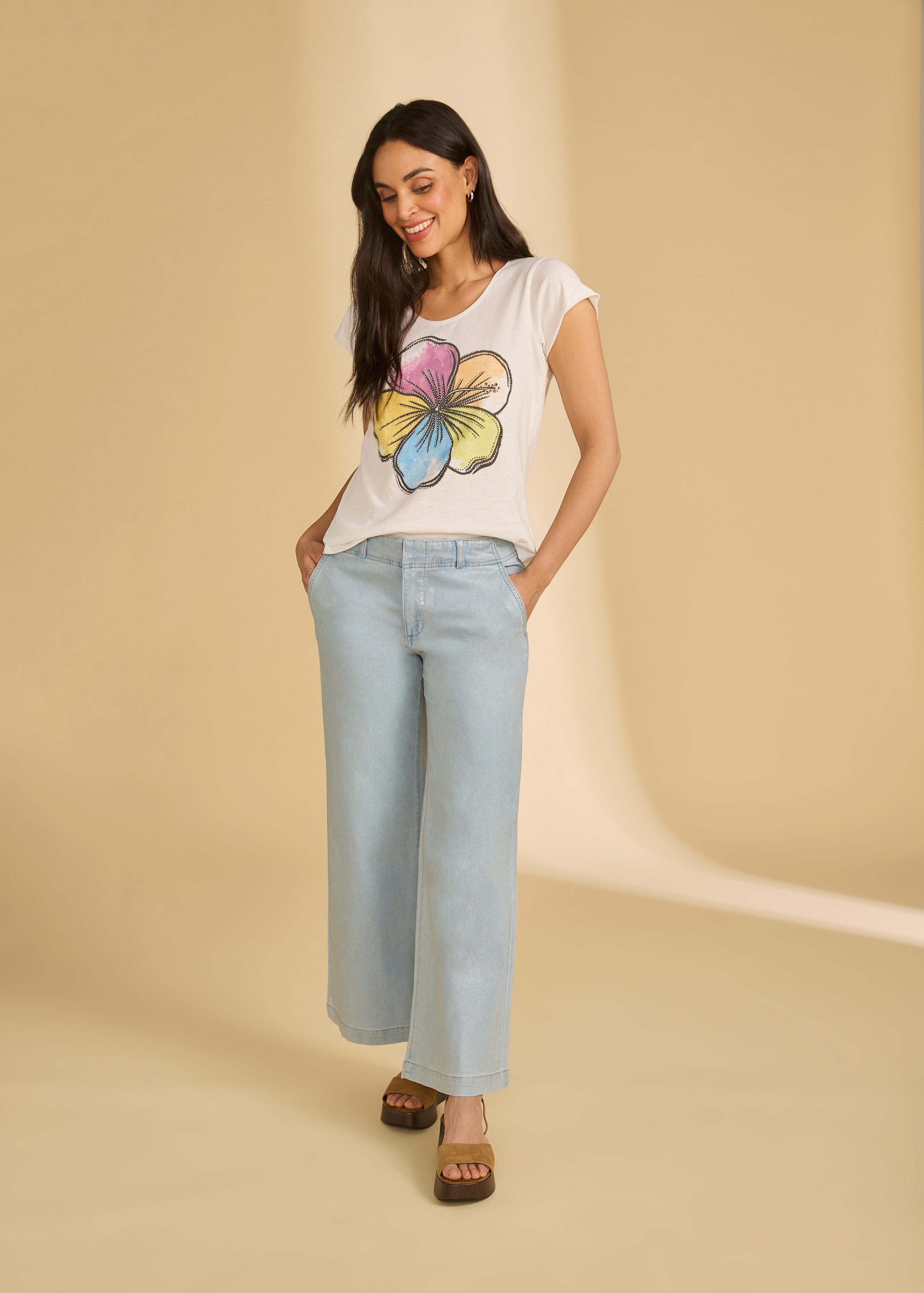 Full outfit view with Rainbow Hibiscus top and light denim jeans, highlighting casual style by French Dressing Jeans (FDJ)