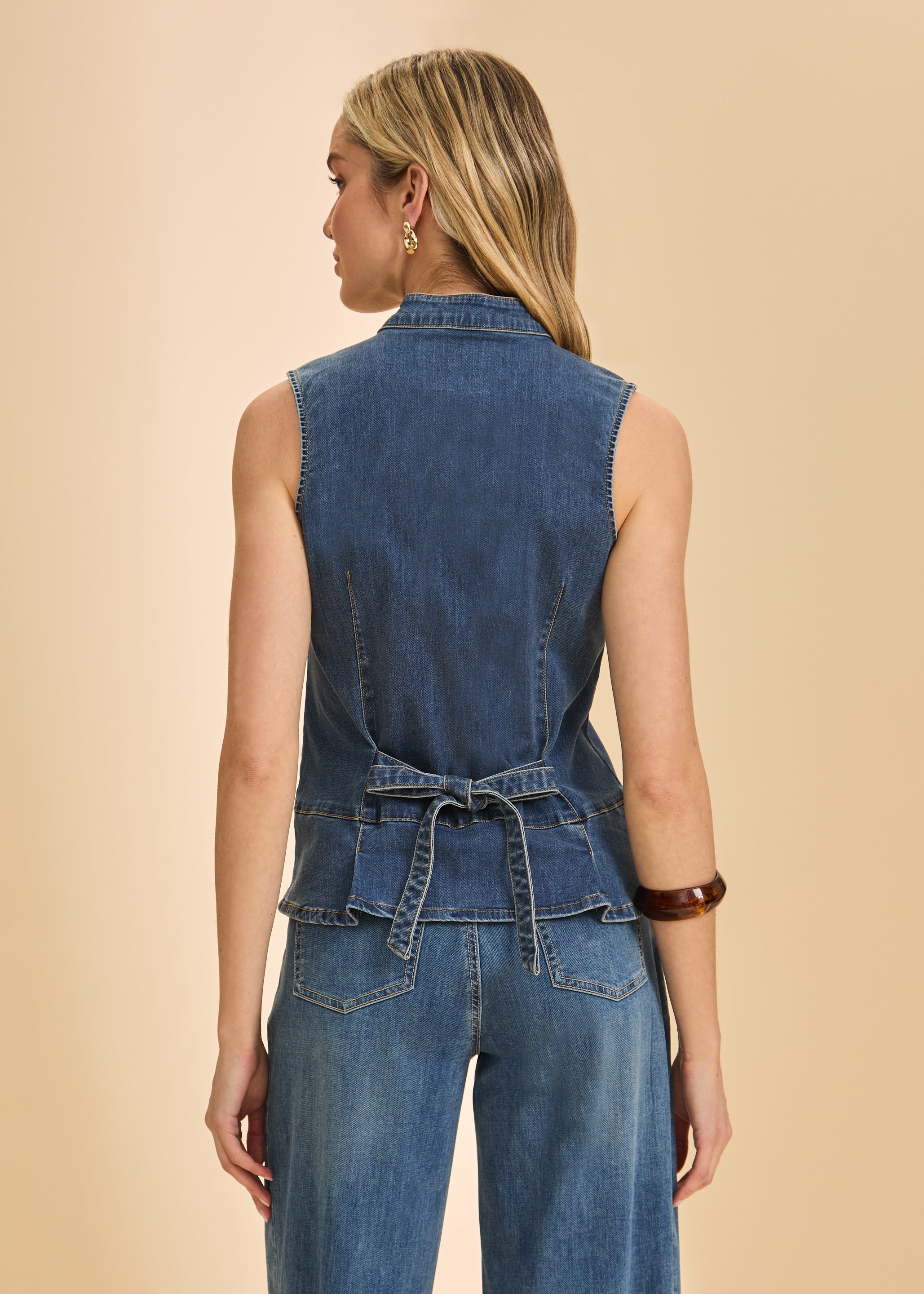 Back view of dark wash sleeveless denim top with tie detail and seam lines by French Dressing Jeans (FDJ)