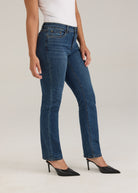 Side profile of Olivia straight leg denim in dark wash highlighting slim fit and mid-rise waist by French Dressing Jeans (FDJ)