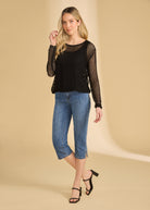 Full view of black mesh top paired with cropped jeans and heels by French Dressing Jeans (FDJ)