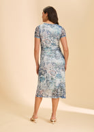 Back view of blue printed dress highlighting intricate pattern and knee-length by French Dressing Jeans (FDJ)
