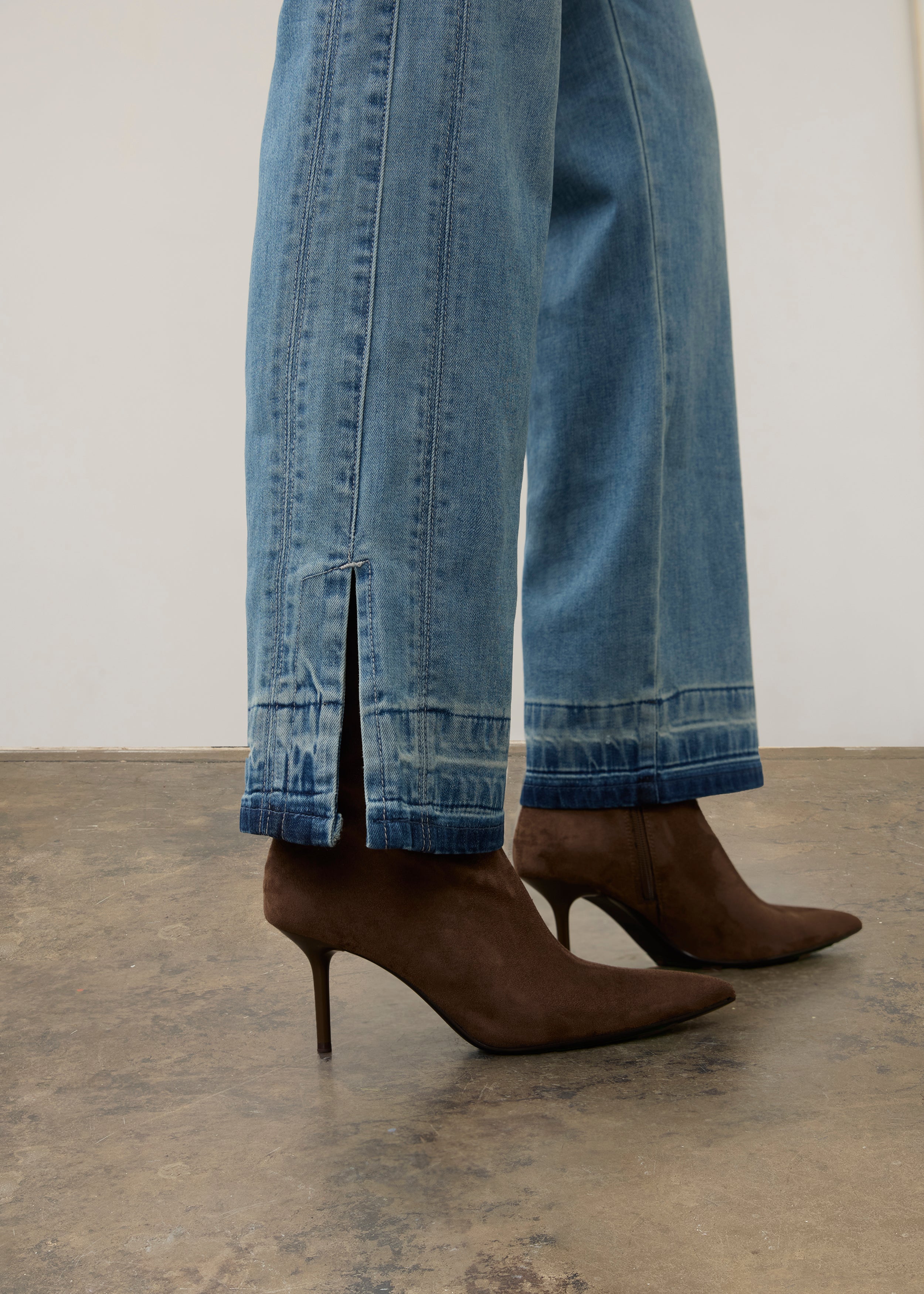 Side view of light wash denim pants highlighting hem details and straight leg cut by French Dressing Jeans (FDJ) par French Dressing Jeans (FDJ)