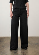 Close-up of black wide-leg jeans highlighting front pockets and waistband by French Dressing Jeans (FDJ)