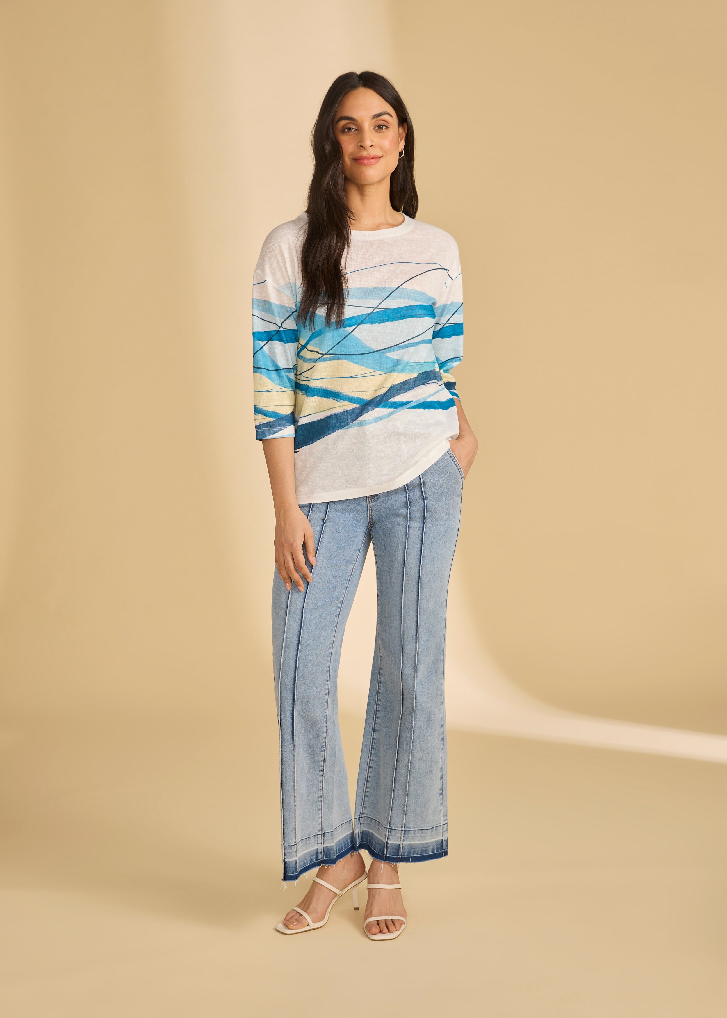 Full-body view of light metallic lime trousers with abstract patterned top by French Dressing Jeans (FDJ)