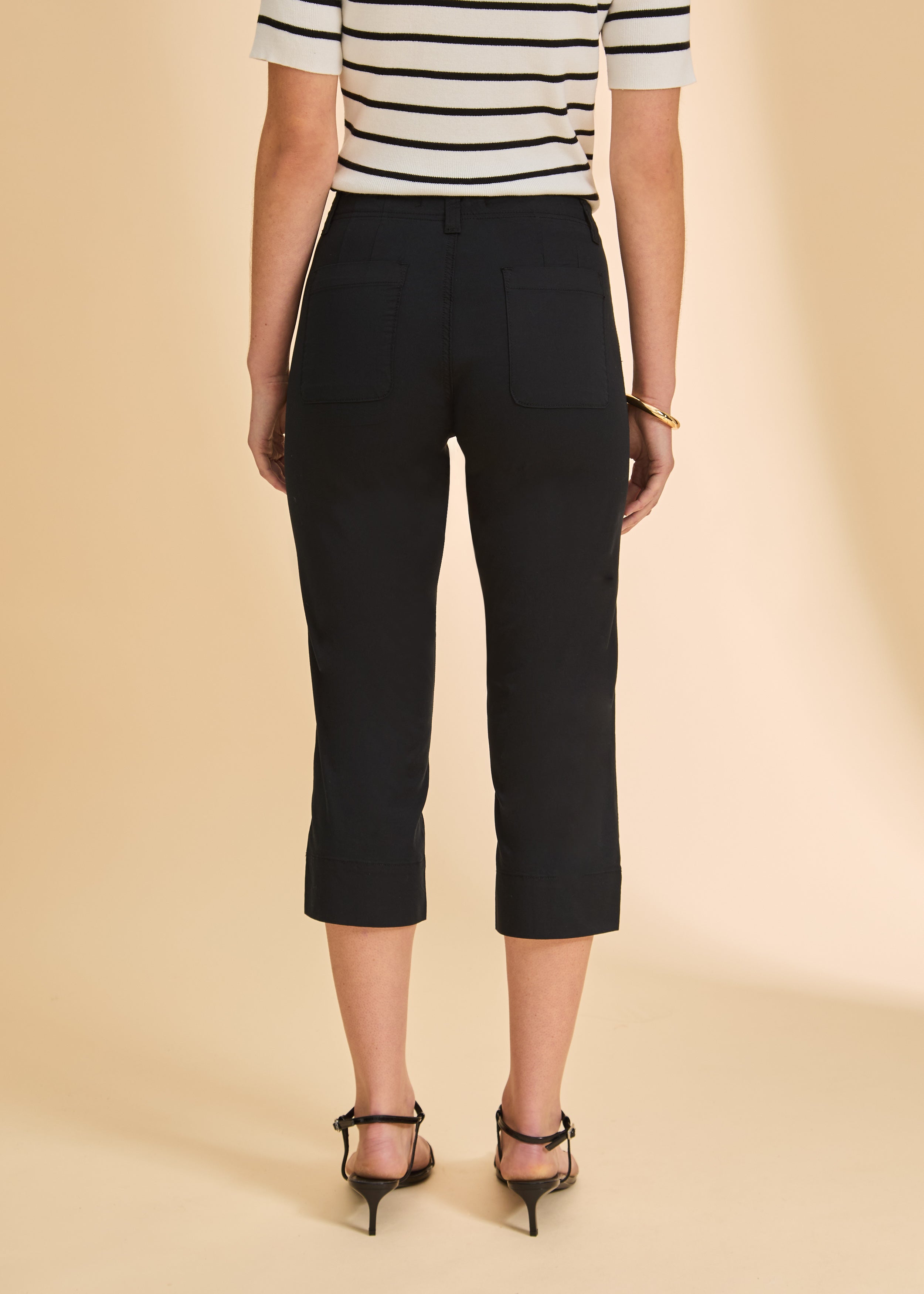 Back view of black crop pants with patch pockets and fitted design by French Dressing Jeans (FDJ)