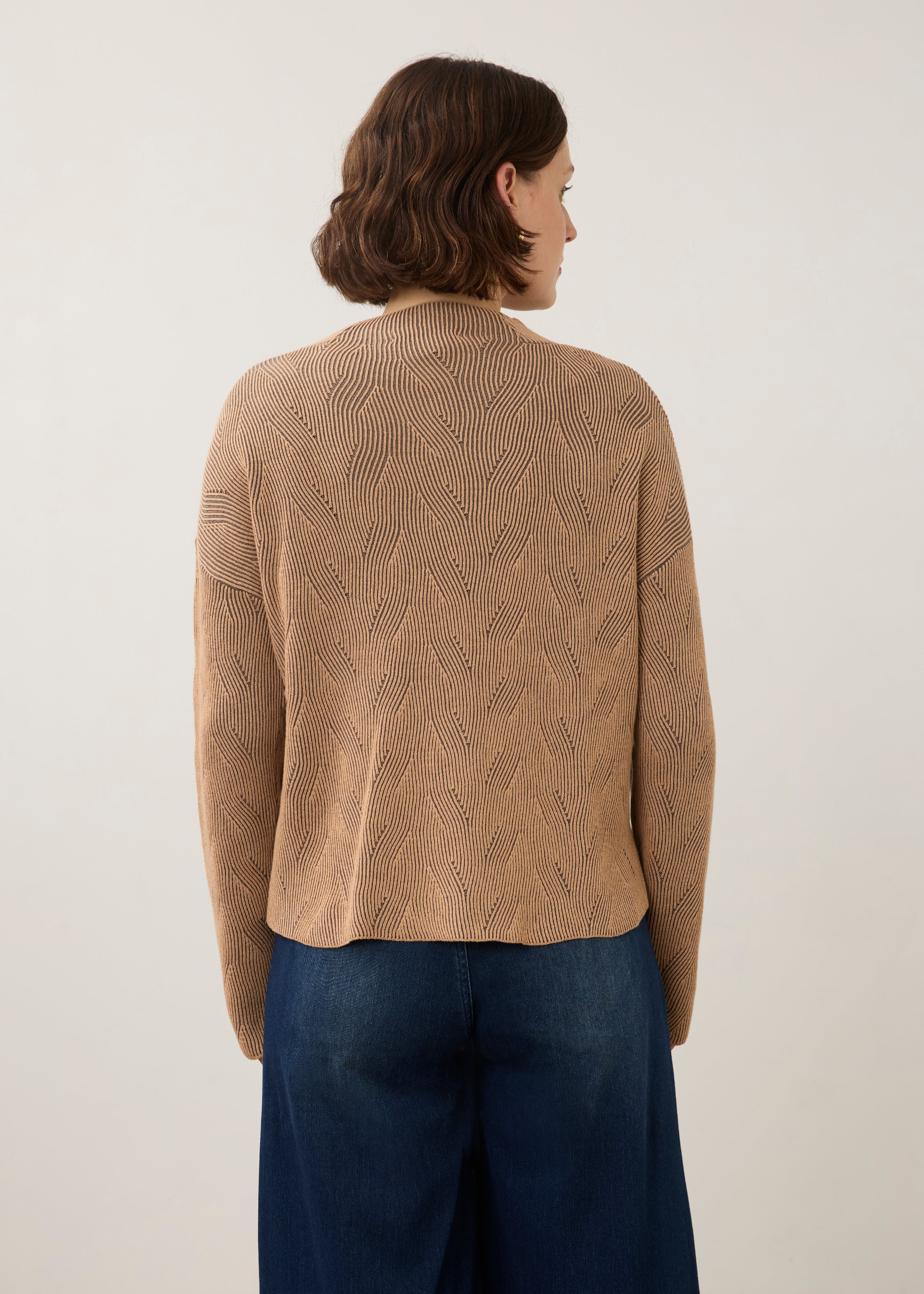 Back view of tan textured top showing seamless design by French Dressing Jeans (FDJ)