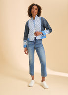 Full body view of patterned quilted jacket styled with jeans and sneakers by French Dressing Jeans (FDJ)