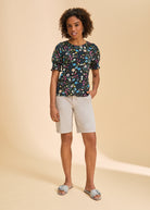 Front view of Petite Suzanne shorts in taupe, paired with floral top by French Dressing Jeans (FDJ)