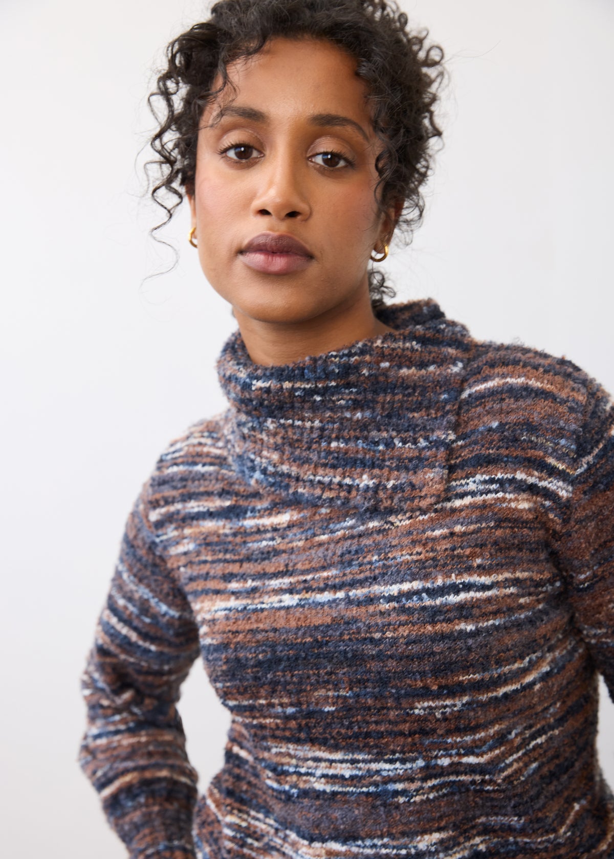 Close-up of indigo spacedye sweater highlighting enveloppe collar and textured knit by French Dressing Jeans (FDJ)