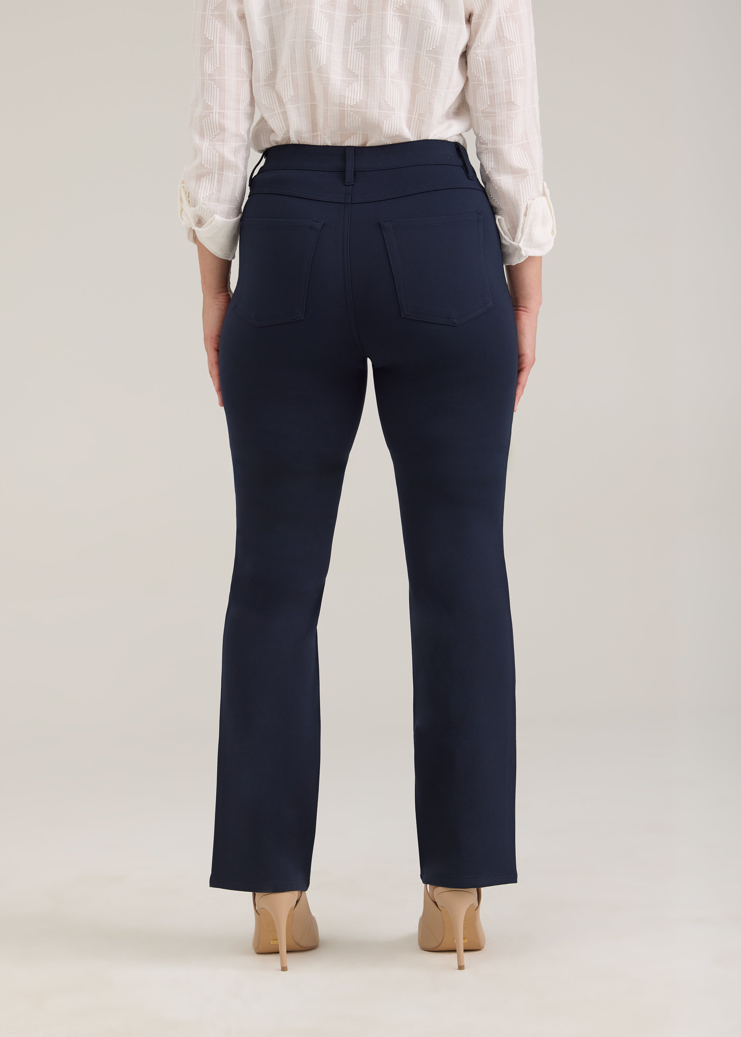 Back view of navy pants featuring patch pockets by French Dressing Jeans (FDJ)