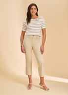 Full view of beige and white stripe sweater paired with light beige pants by French Dressing Jeans (FDJ)