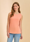 Front view of coral sleeveless top with round neckline paired with light denim by French Dressing Jeans (FDJ)