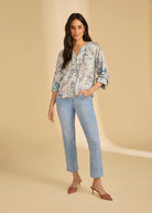 Full view of model wearing Neutral Narnia printed shirt paired with jeans by French Dressing Jeans (FDJ)