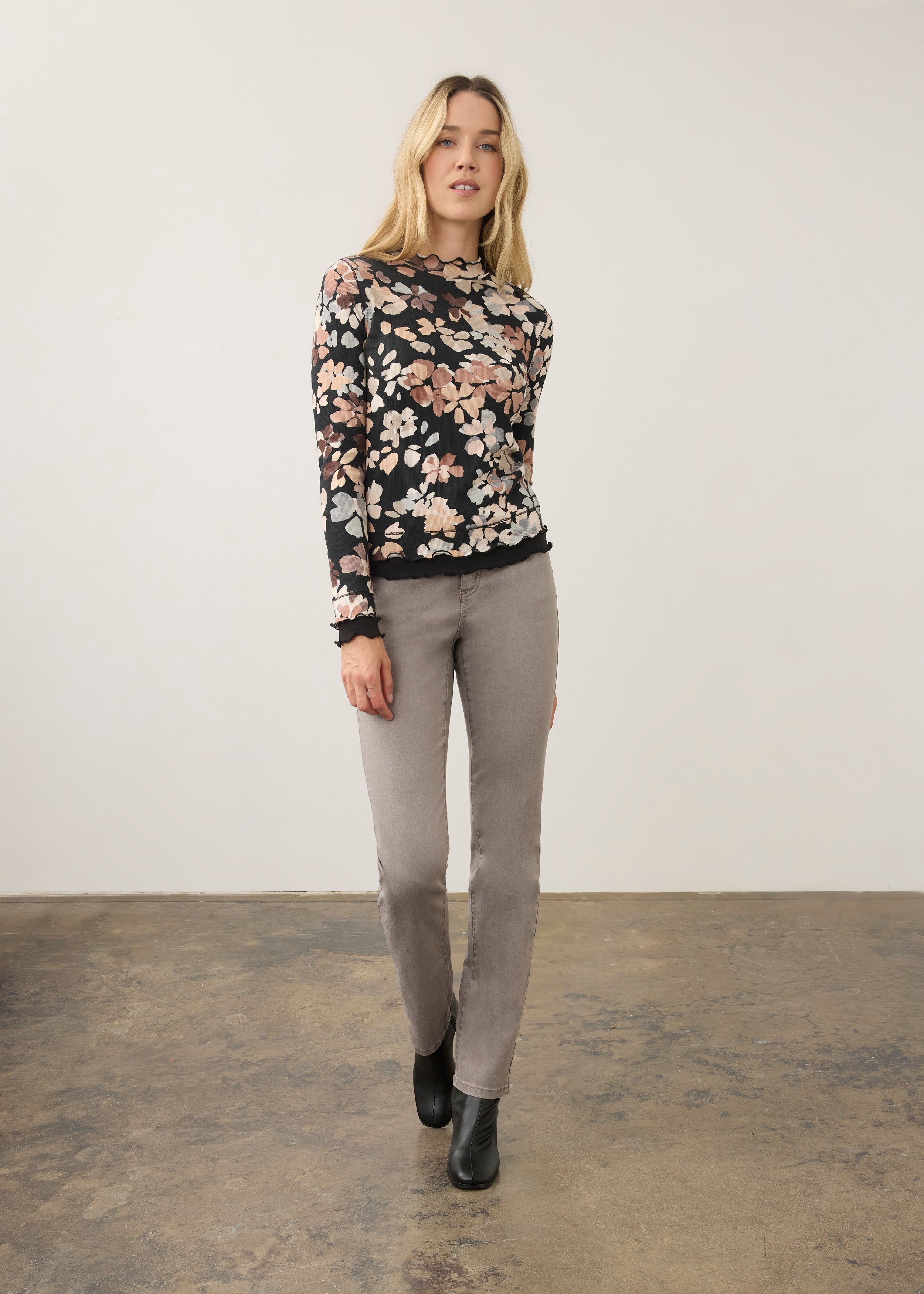 Full body view of floral black top with gray jeans, elegant casual look by French Dressing Jeans (FDJ)