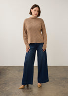 Model in tan textured top paired with wide-leg pants, full outfit view by French Dressing Jeans (FDJ)