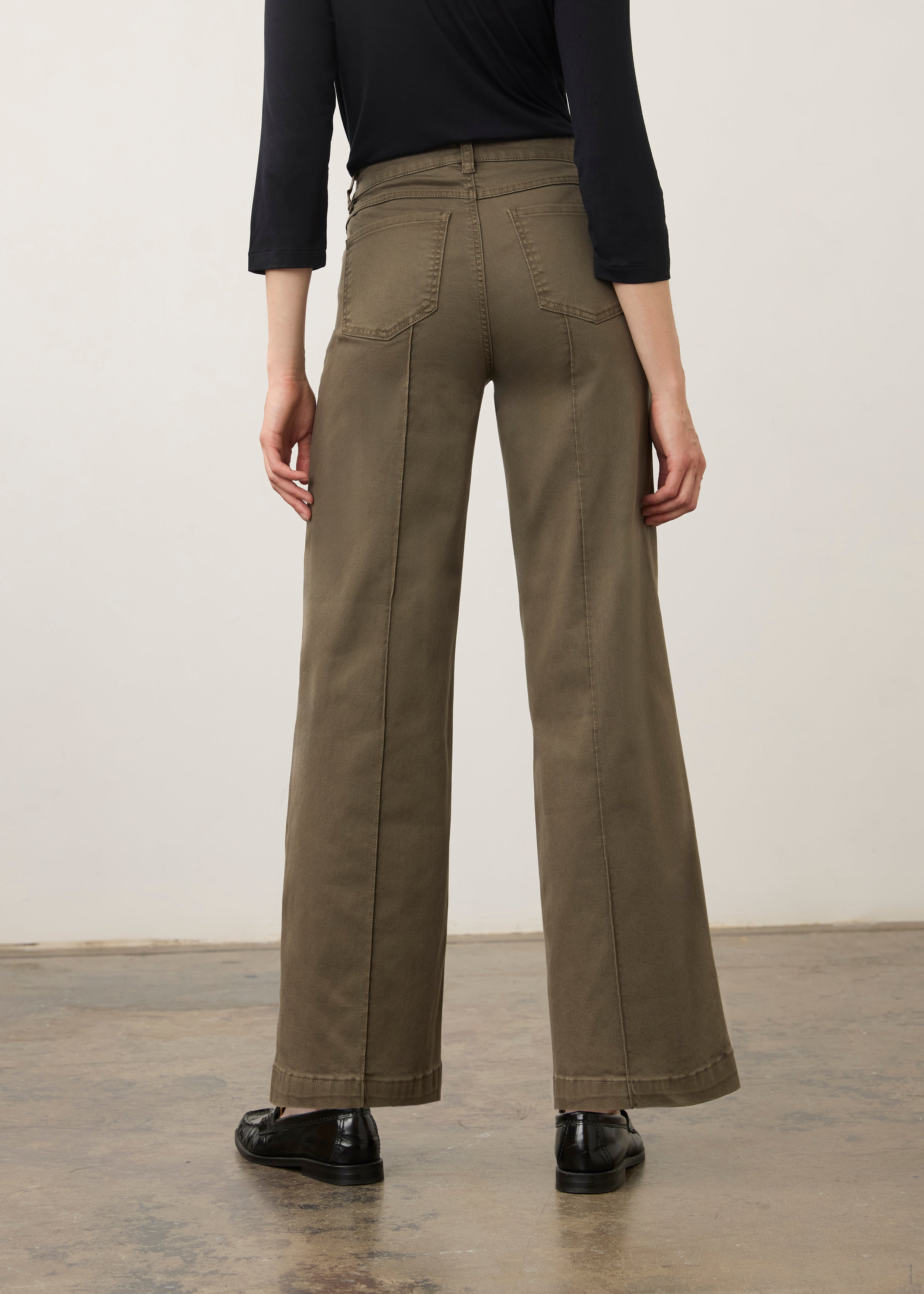 Back view of olive wide-leg denim showcasing patch pockets by French Dressing Jeans (FDJ) par French Dressing Jeans (FDJ)