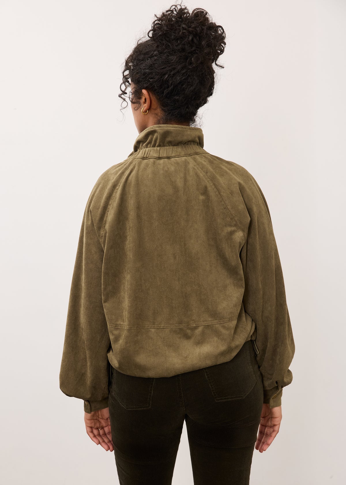 Back view of olive jacket highlighting relaxed fit and texture by French Dressing Jeans (FDJ)