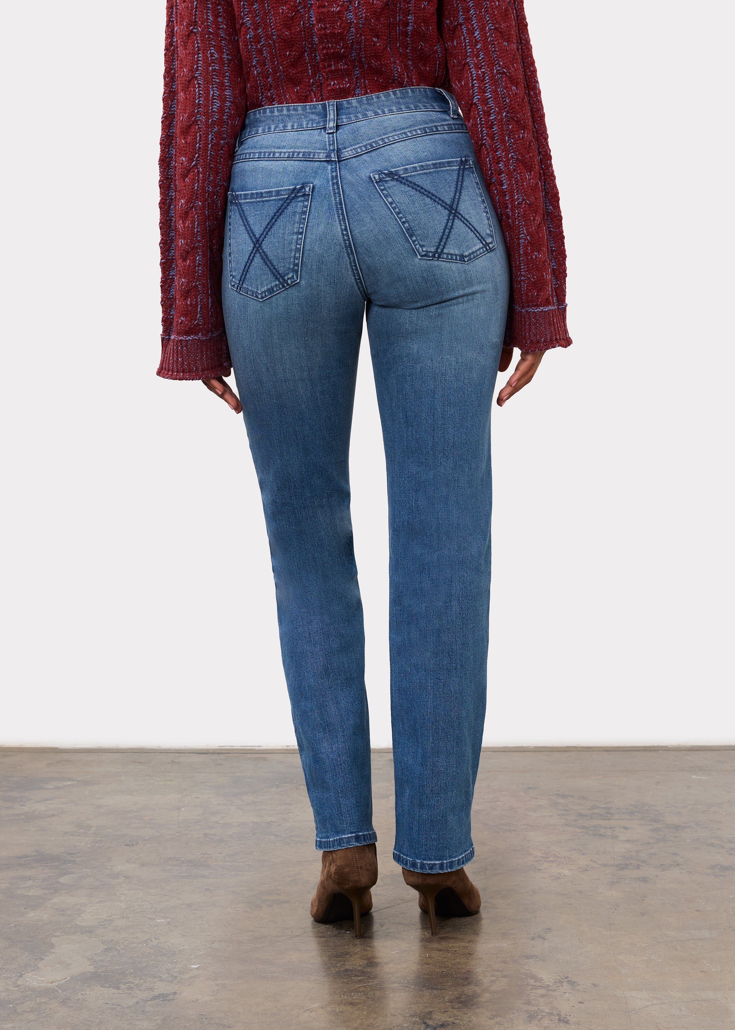 Back view of indigo jeans highlighting patch pockets and mid-rise waist by French Dressing Jeans (FDJ)