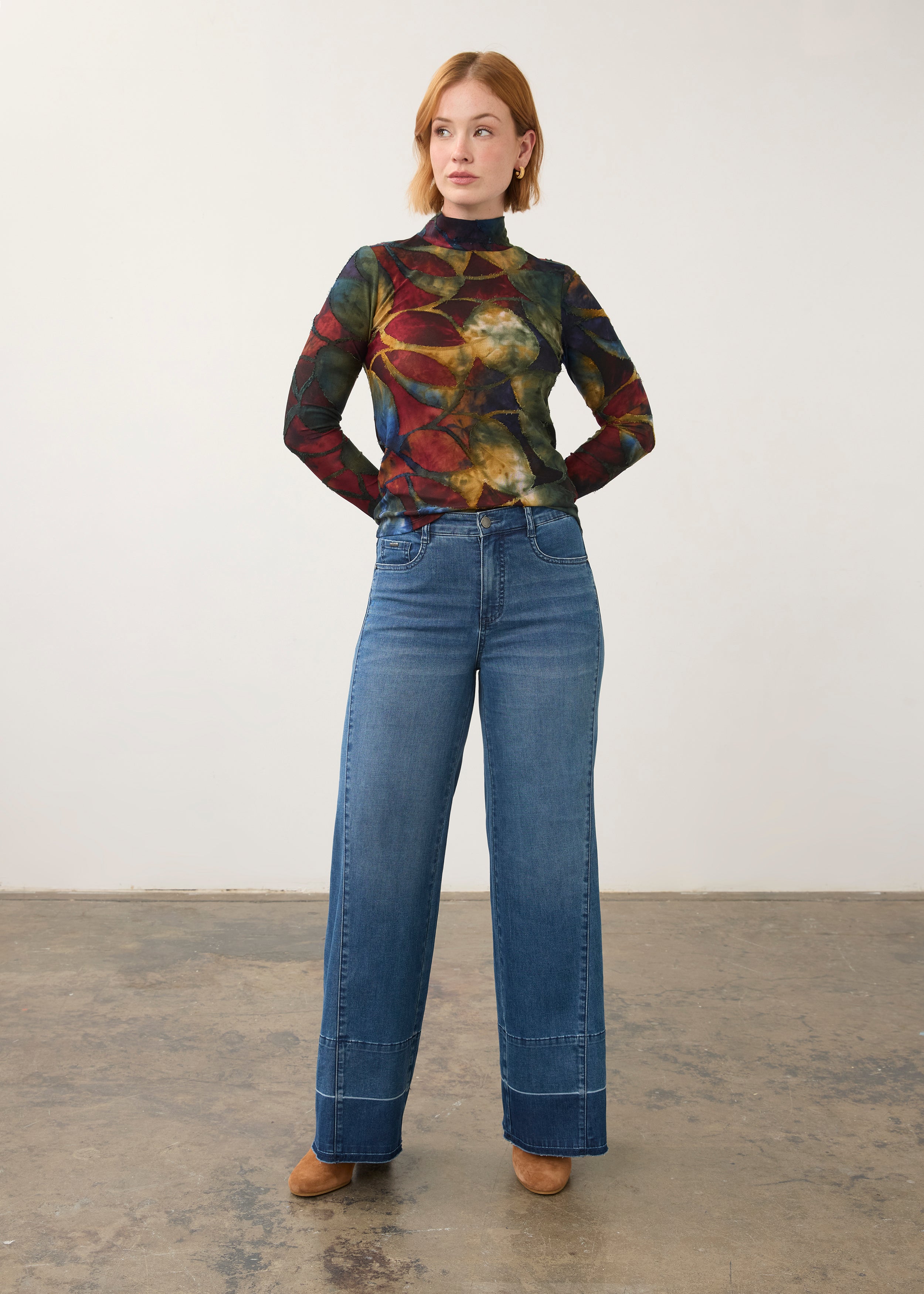 Full body view of abstract print top with denim jeans, artistic casual look by French Dressing Jeans (FDJ)