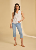 Full body view of cropped jeans in indigo blue styled with sleeveless top by French Dressing Jeans (FDJ)