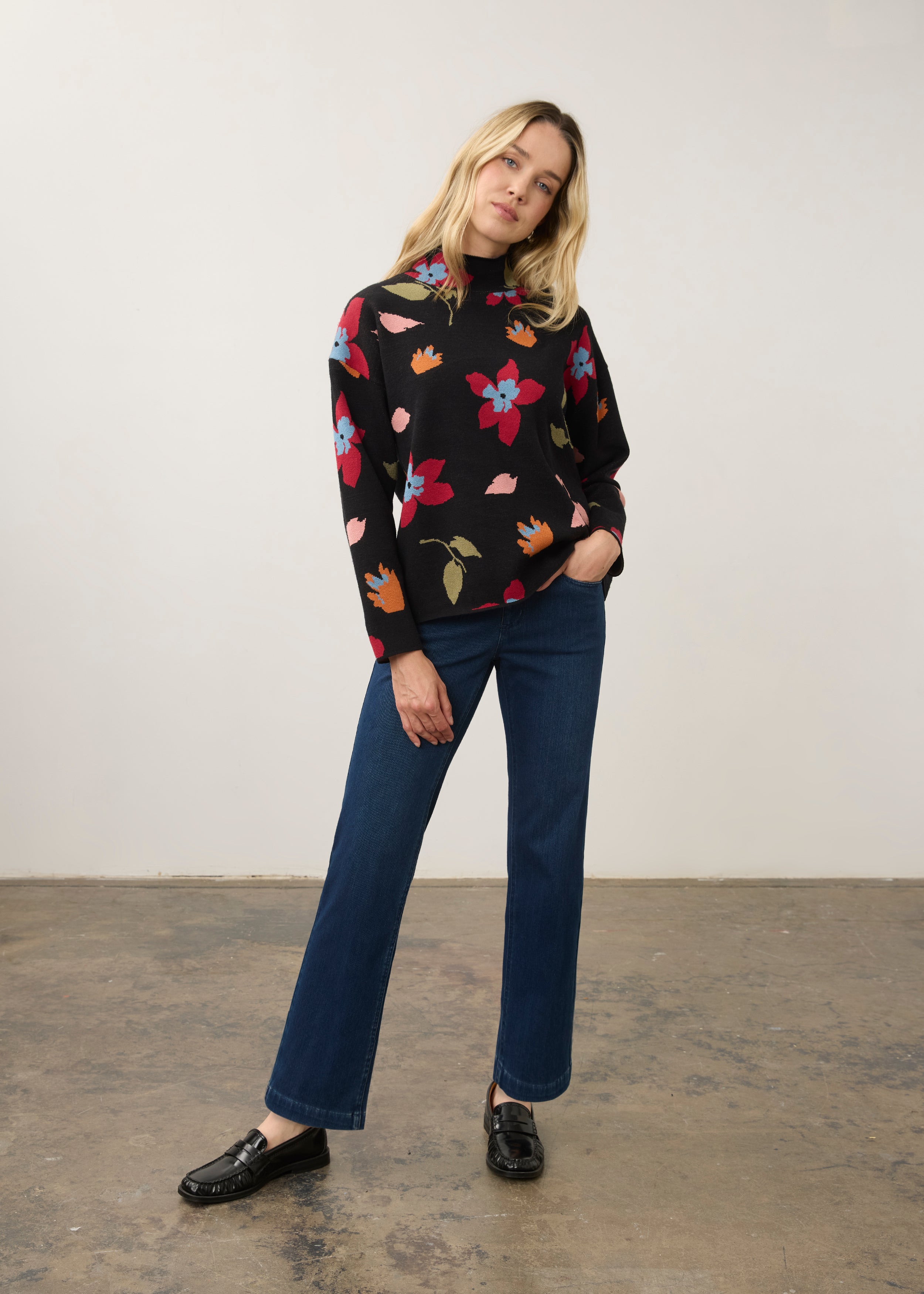 Model in black floral sweater with blue jeans, full outfit view by French Dressing Jeans (FDJ)
