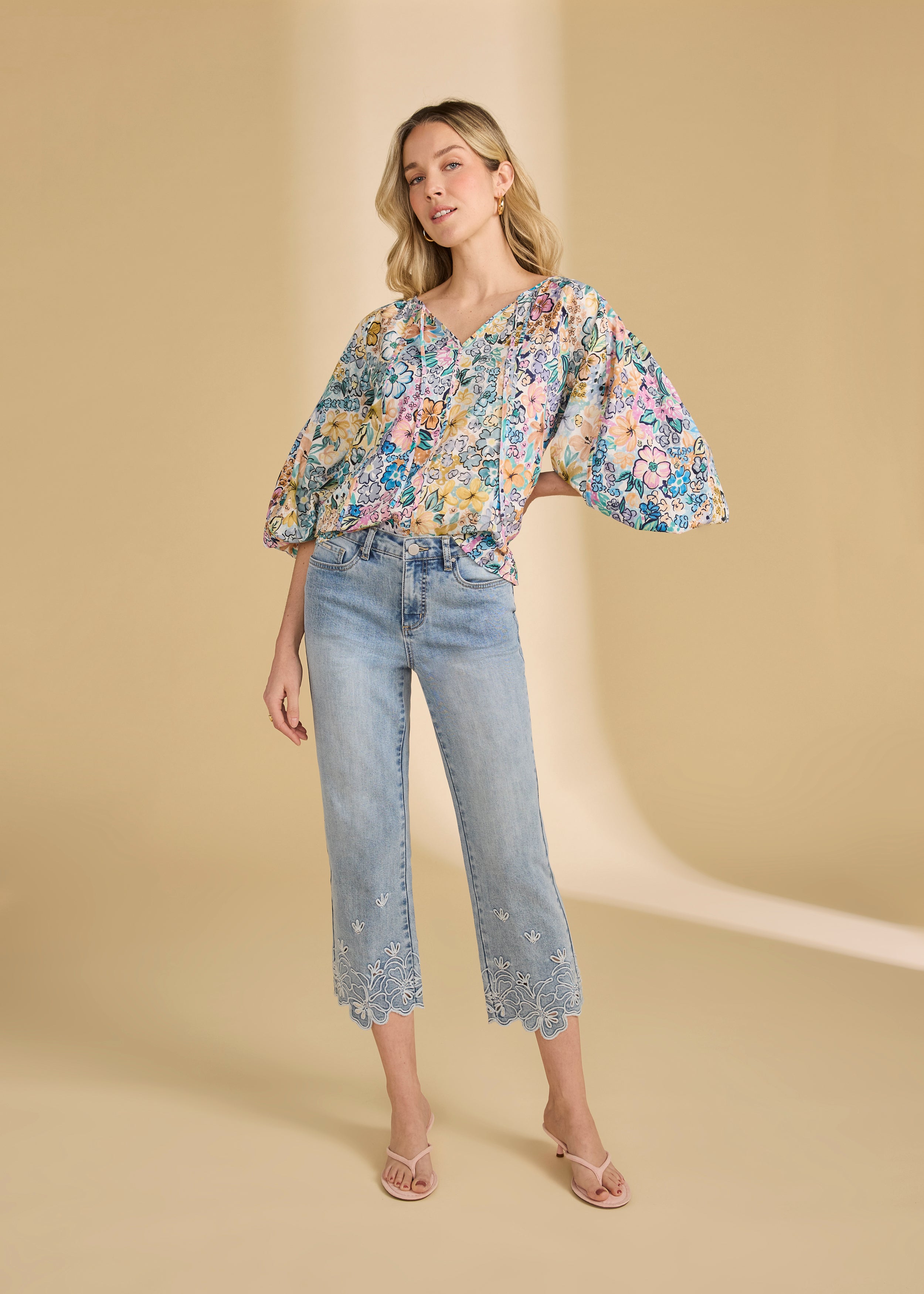 Model in floral embroidered ocean denim jeans with relaxed style by French Dressing Jeans (FDJ)
