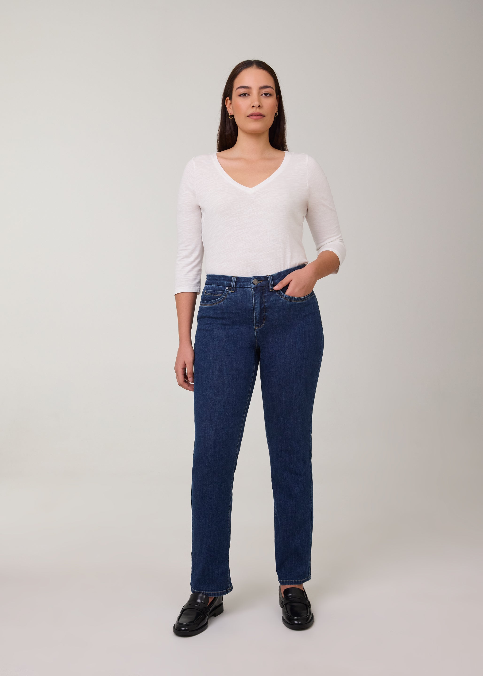Model in tapered straight leg jeans in Delight color by French Dressing Jeans (FDJ)