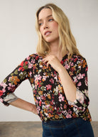 Close-up of vibrant floral shirt showing V-neck and print by French Dressing Jeans (FDJ)