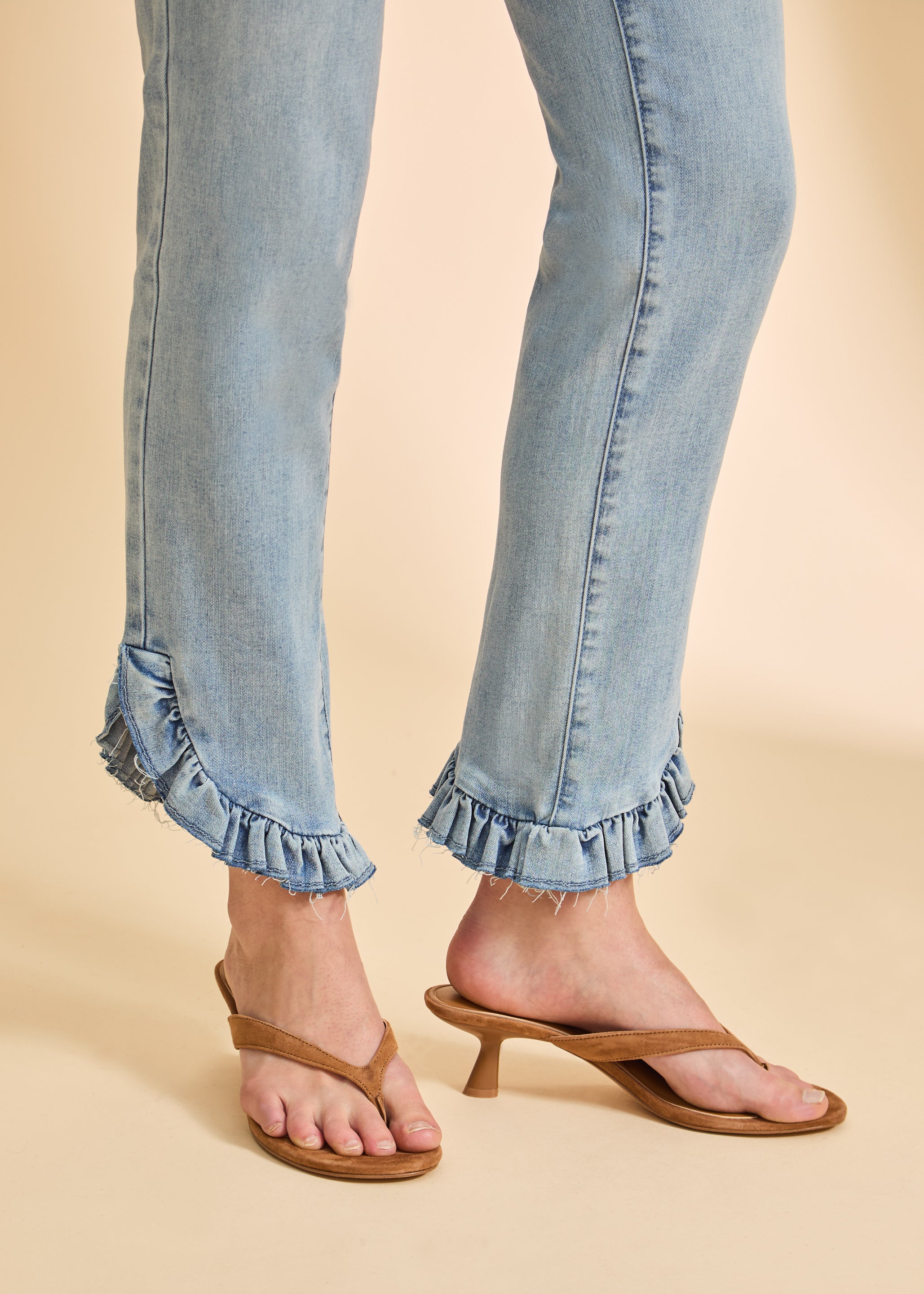 Detail shot of frayed hem on blue eclipse pull-on boot crop denim by French Dressing Jeans (FDJ)