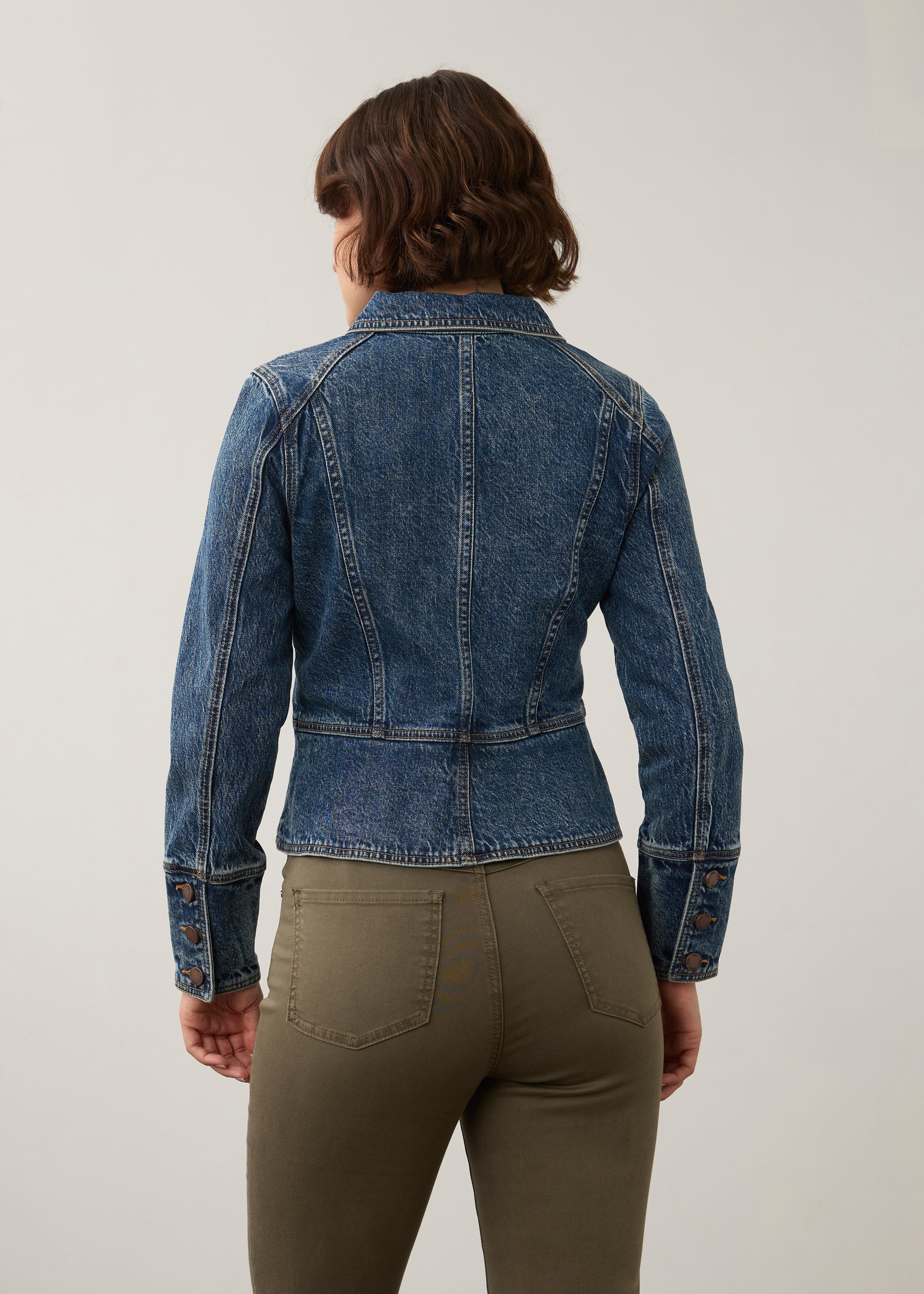 Back view of medium blue utility jacket showcasing seams and buttoned cuffs by French Dressing Jeans (FDJ) par French Dressing Jeans (FDJ)