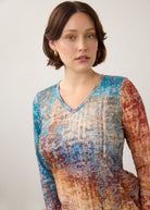 Close-up of V-neck and pattern detail on colorful gradient long sleeve top by French Dressing Jeans (FDJ)
