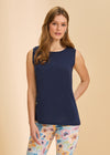 Front view of navy sleeveless top paired with colorful floral pants for a bold look by French Dressing Jeans (FDJ)