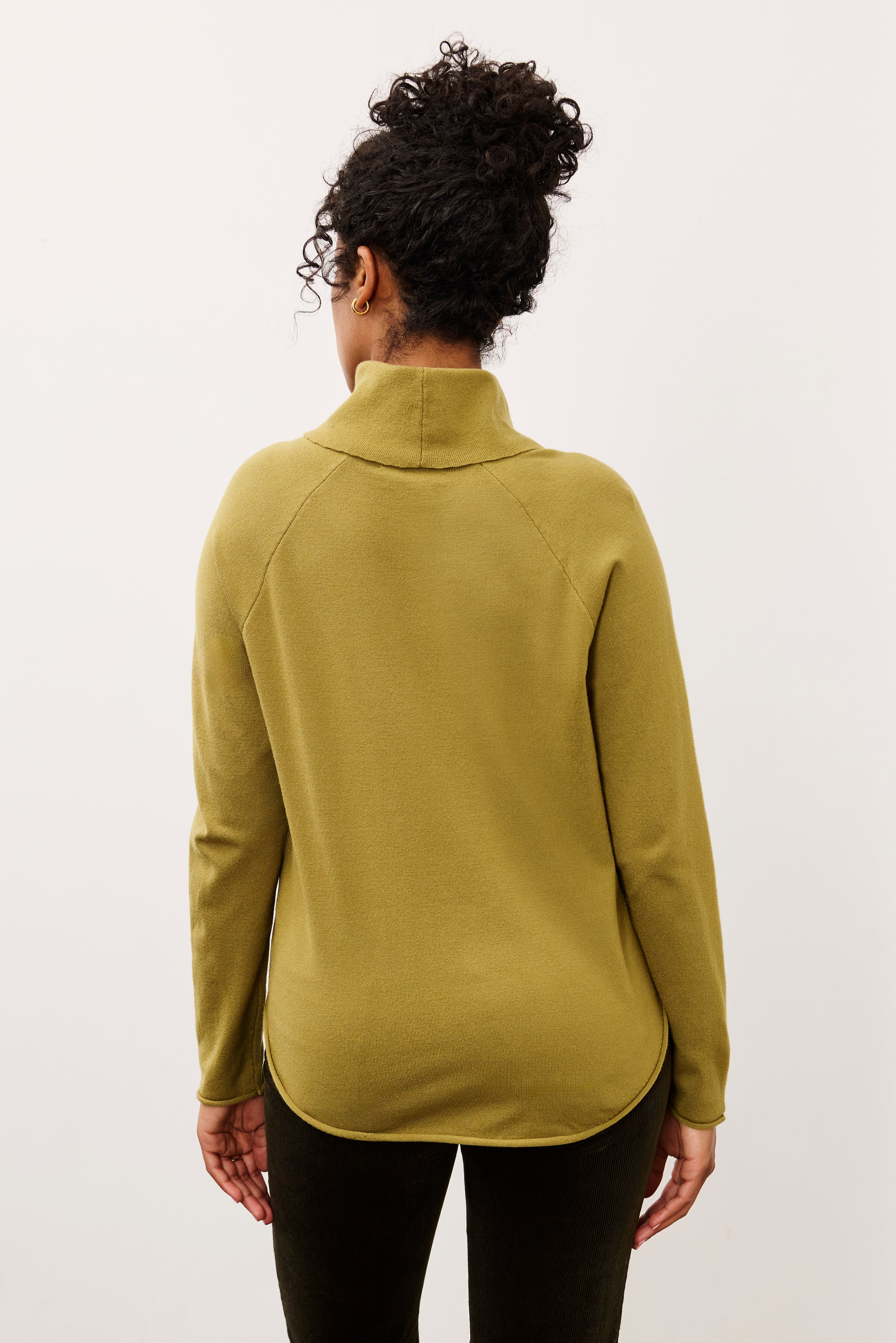 Back view of olive sweater with seamless shoulder design by French Dressing Jeans (FDJ)