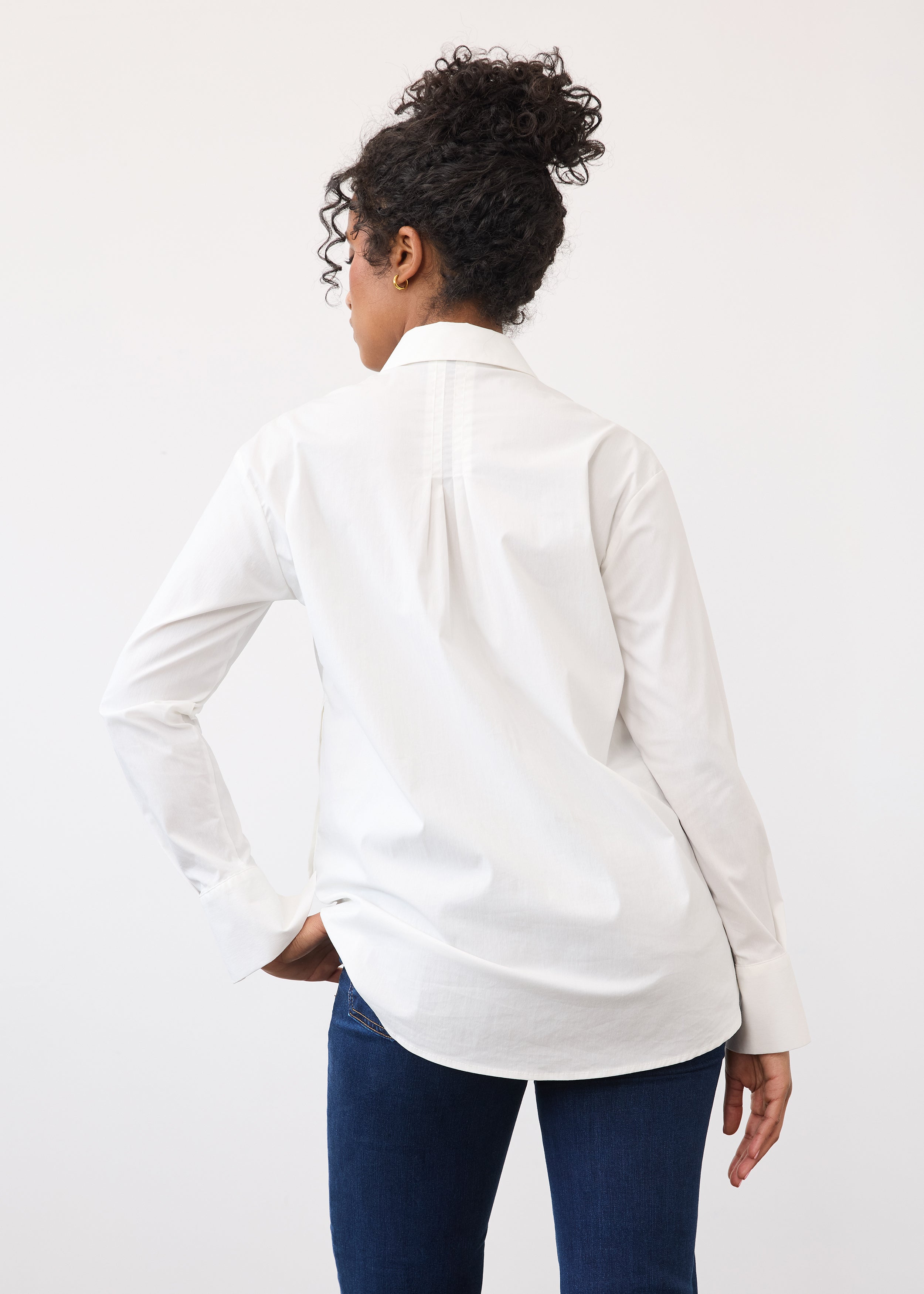 Back view of white shirt featuring a pleated yoke and long sleeves by French Dressing Jeans (FDJ)
