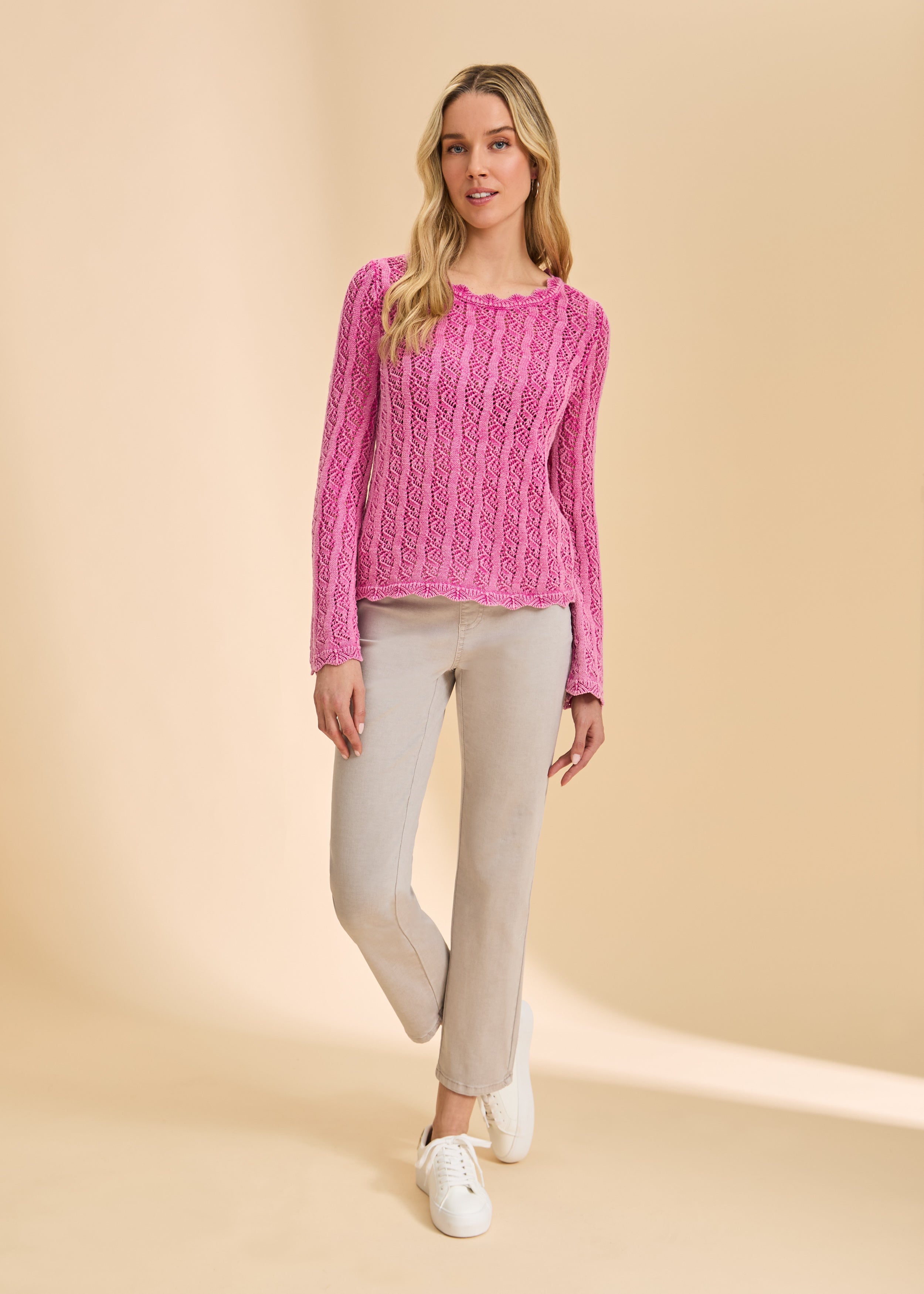 Front view of taupe straight-leg jeans, paired with pink sweater by French Dressing Jeans (FDJ)