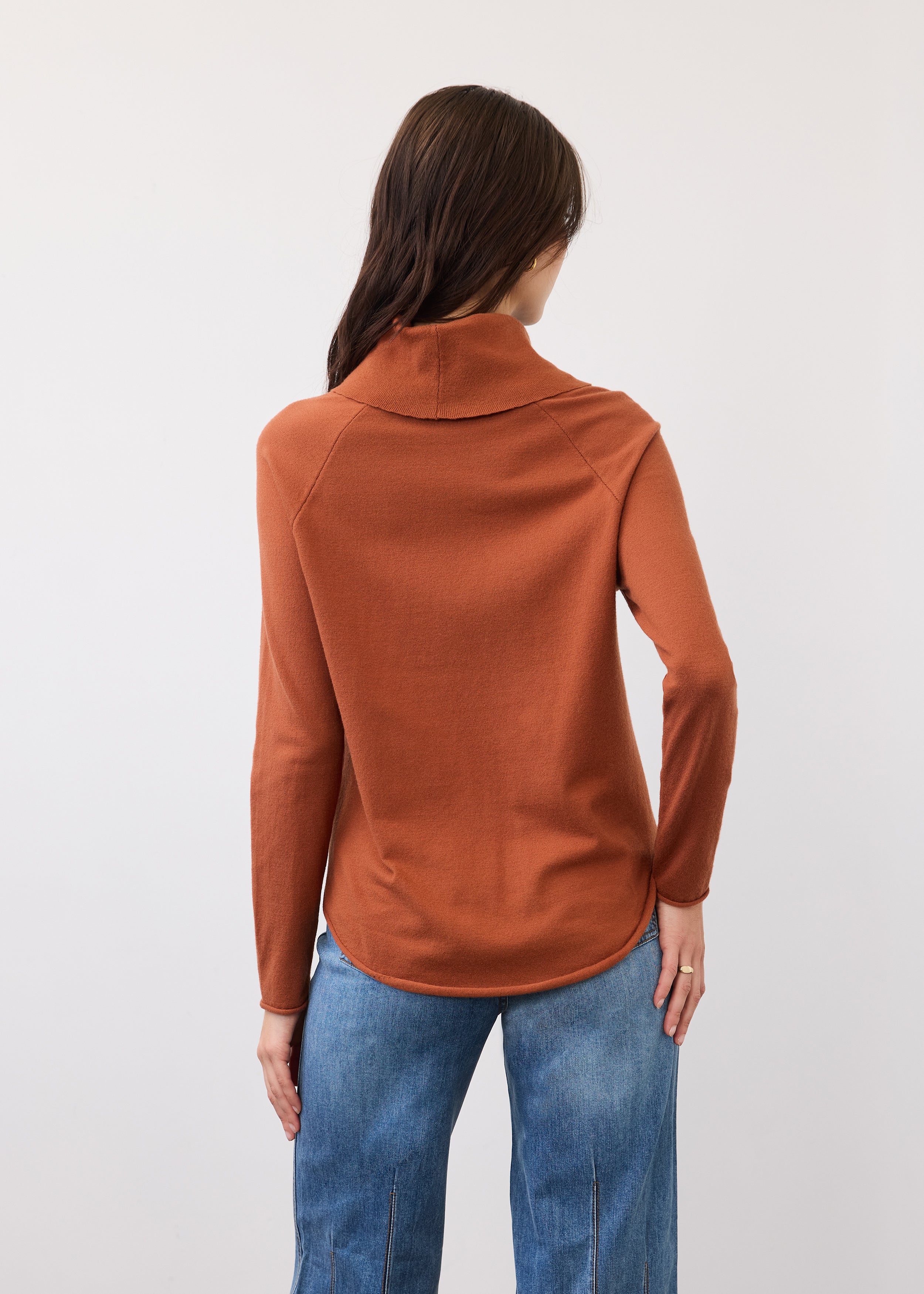 Back view of rust sweater with seamless shoulder design by French Dressing Jeans (FDJ)