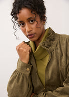 Close-up of olive jacket showing collar and zipper closure details by French Dressing Jeans (FDJ)