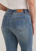 Detail shot of back pockets and waistline on light wash Olivia straight leg denim by French Dressing Jeans (FDJ)
