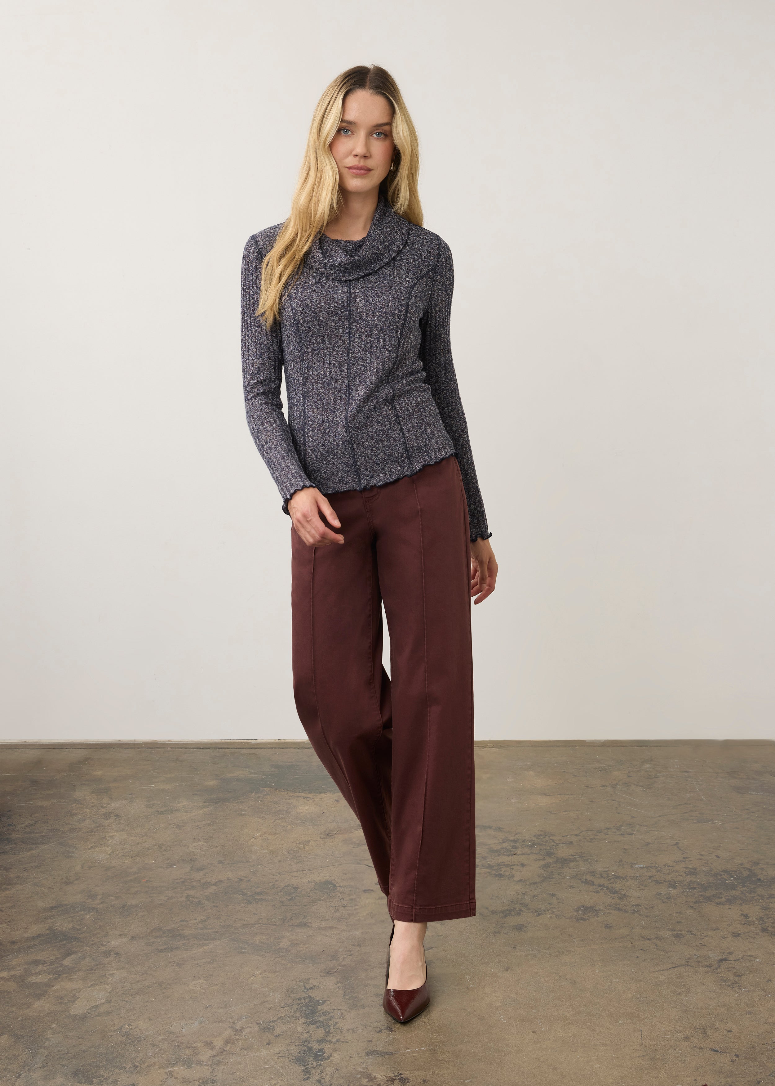 Full body view of blue cowl neck top paired with maroon pants by French Dressing Jeans (FDJ)