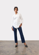Full body view wearing dark blue straight ankle denim highlighting smooth fit by French Dressing Jeans (FDJ)