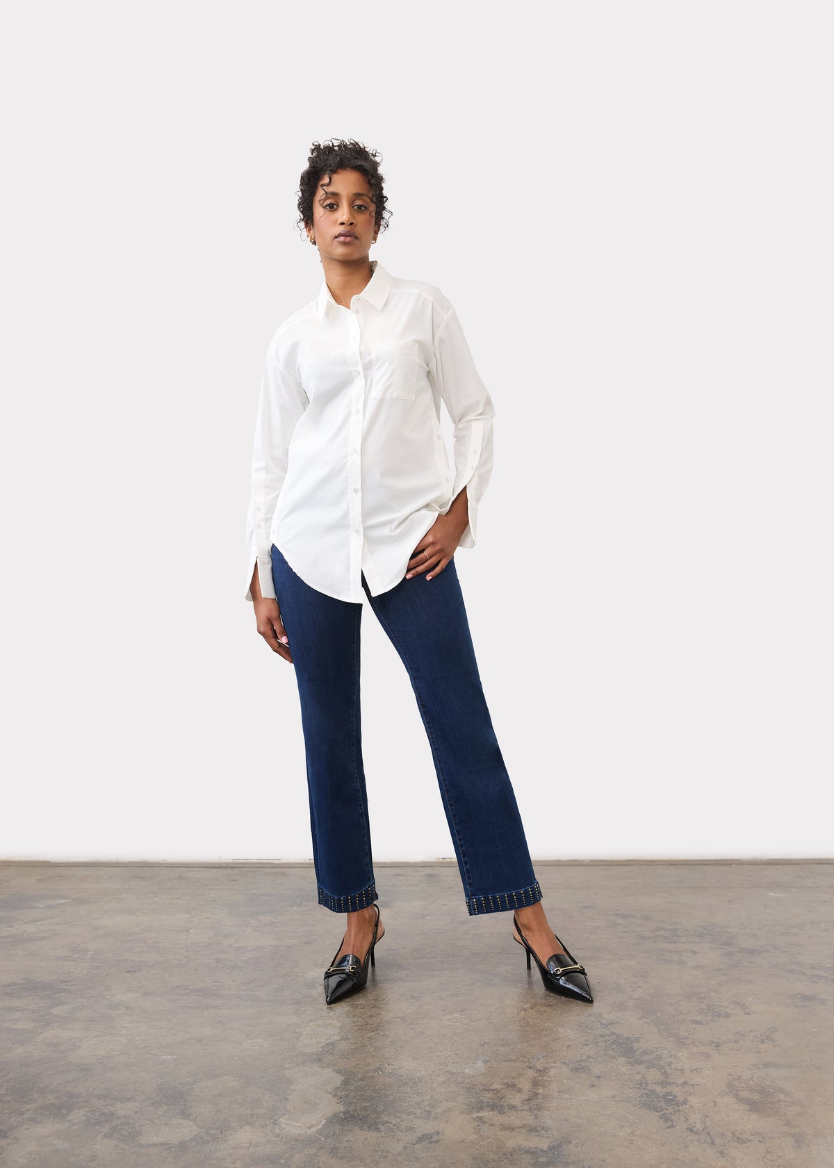 Full body view wearing dark blue straight ankle denim highlighting smooth fit by French Dressing Jeans (FDJ)