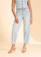 Close-up of light wash denim jeans showing waistline and pocket details by French Dressing Jeans (FDJ)