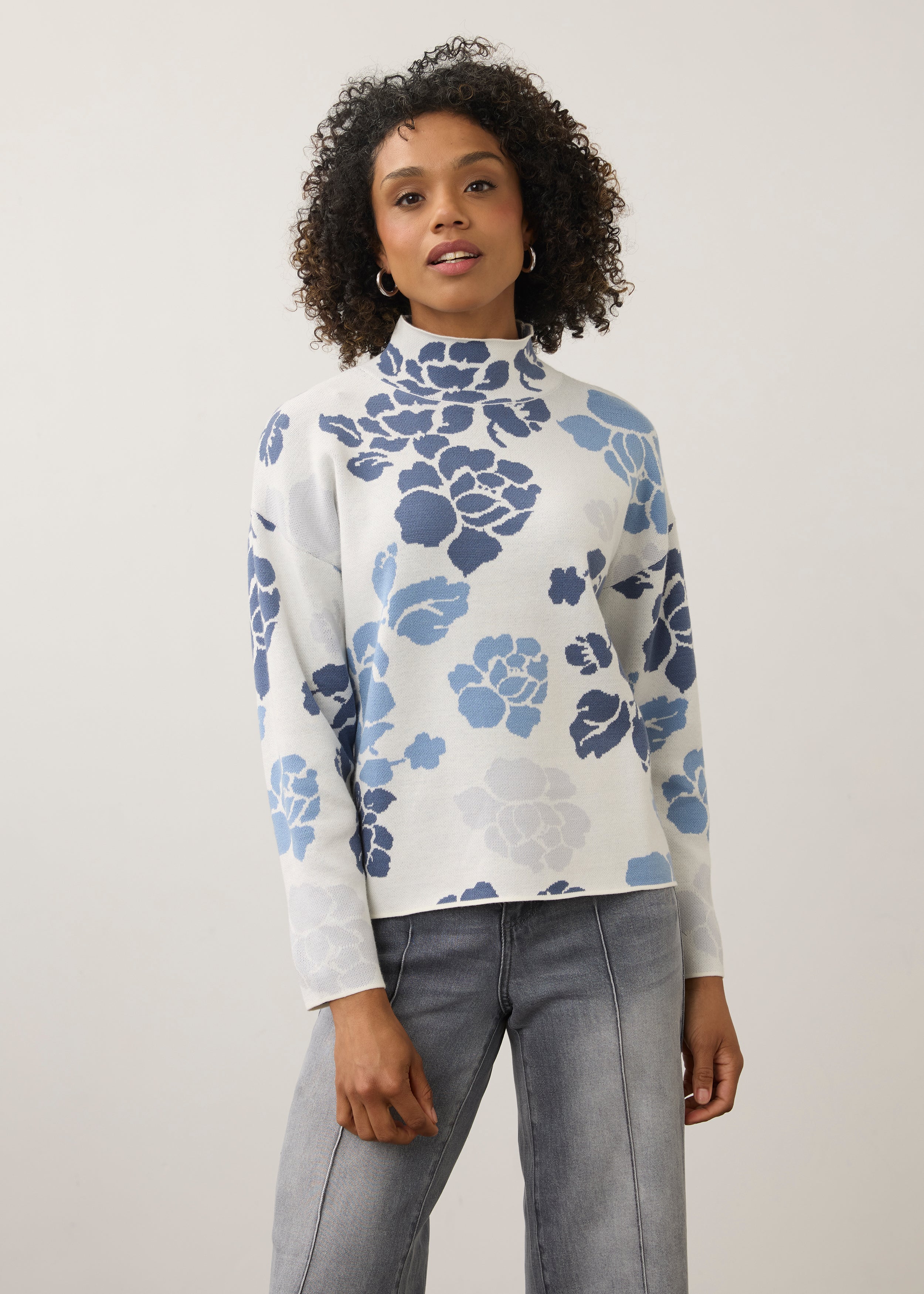 Front view of blue floral sweater with high collar and long sleeves by French Dressing Jeans (FDJ)