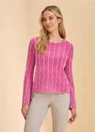 Front view of vibrant pink lace sweater with long sleeves by French Dressing Jeans (FDJ)